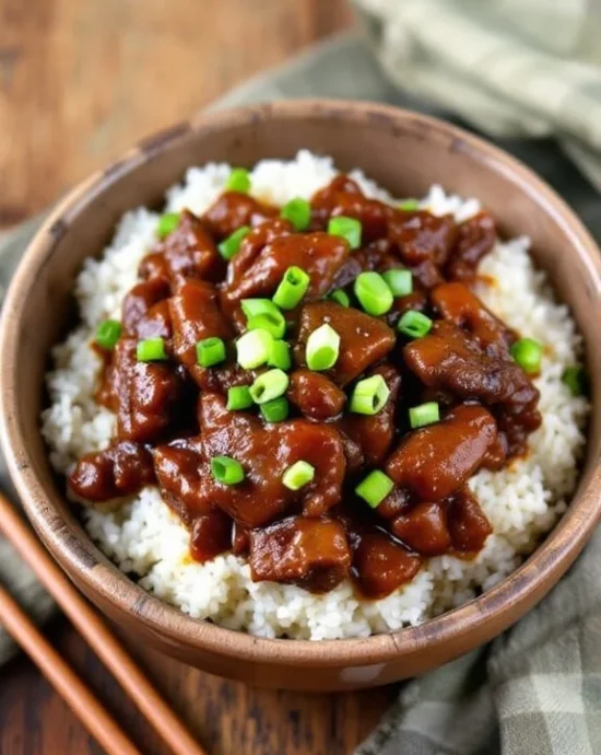 Mongolian Beef with rice on a bowl.